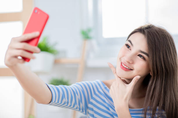 istock woman selfie happy 1132040676