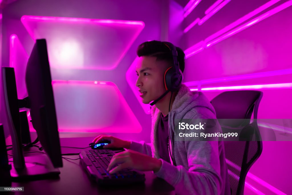 cyber sport gamer playing game Young Asian Handsome Pro Gamer Playing in Online Video Game eSports Stock Photo