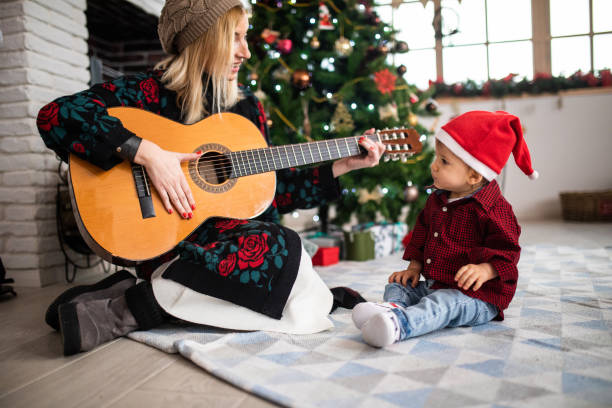 istock Mother playing guitar for her son 1132040795