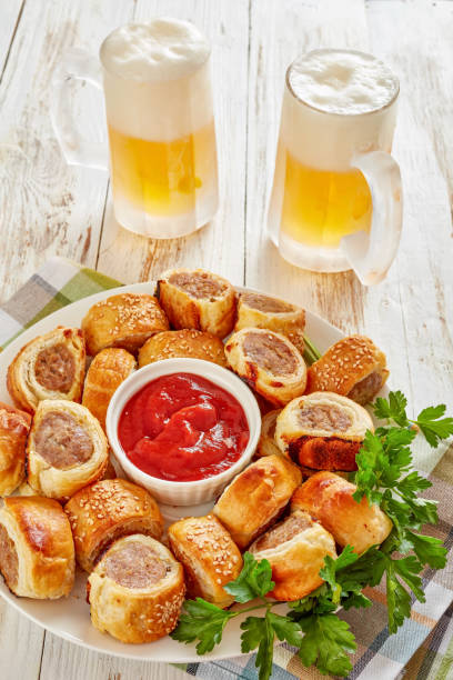 istock sausage rolls with tomato sauce and beer 1132040986