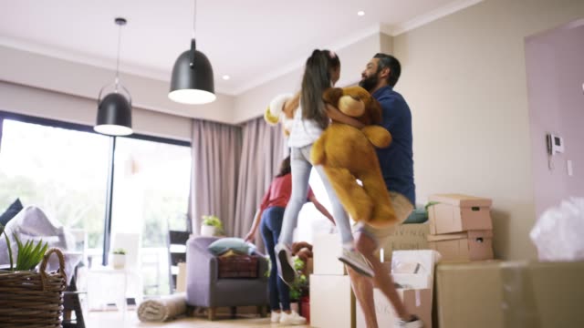 4k footage of a family of three in their new home