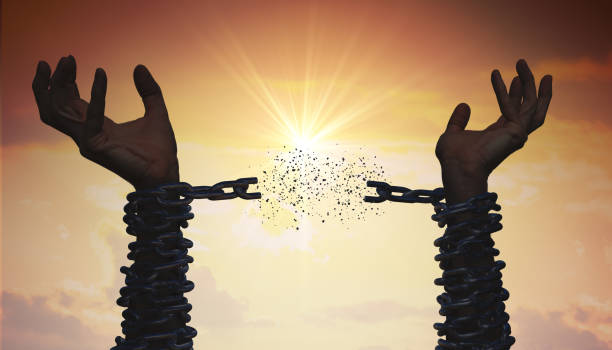 istock Silhouettes of hands are breaking chain. Freedom concept. 1132043757