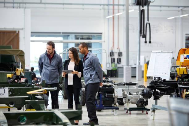 istock Engineers and supervisor at car production line 1132045042