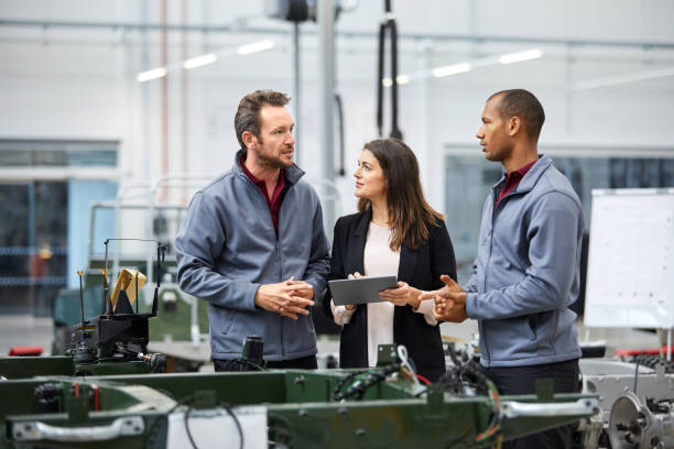 istock Engineers and supervisor discussing in car factory 1132045046