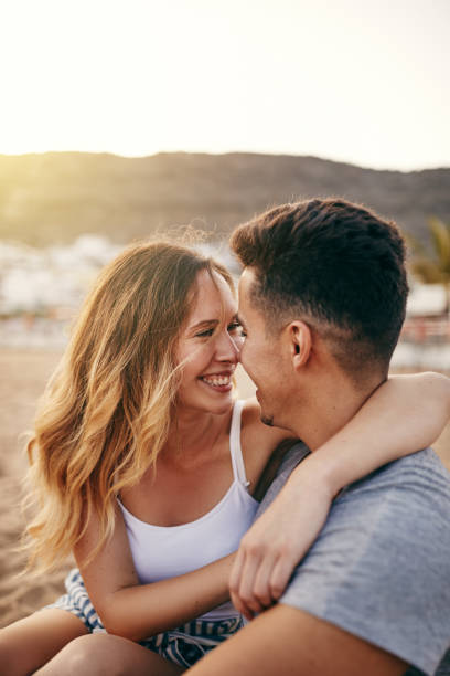 istock Young couple sharing a romantic moment together at the beach 1132045968