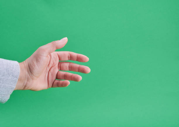 istock female hand showing gesture of holding an object 1132047829
