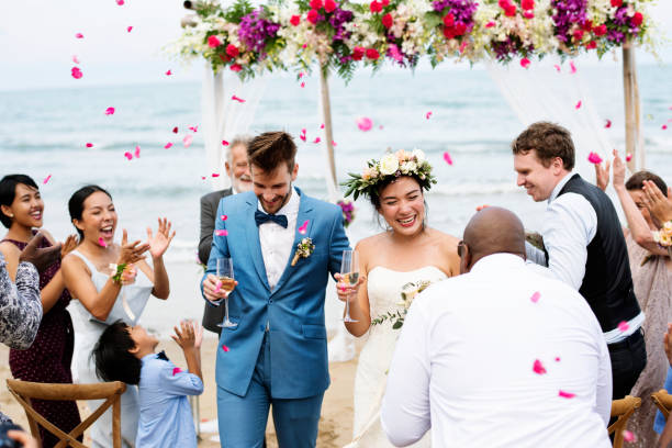 istock Cheerful newlyweds at beach wedding ceremnoy 1132048170