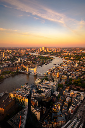 An aerial view over the city, looking towards Tower Bridge and Canary Wharf