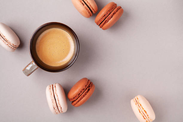 istock Morning cup of coffee and dessert macaron or macaroon top view. Flat lay. 1132049921