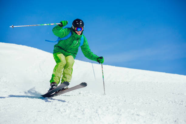 istock Young athlete freestyle Skier having fun while running downhill 1132050689