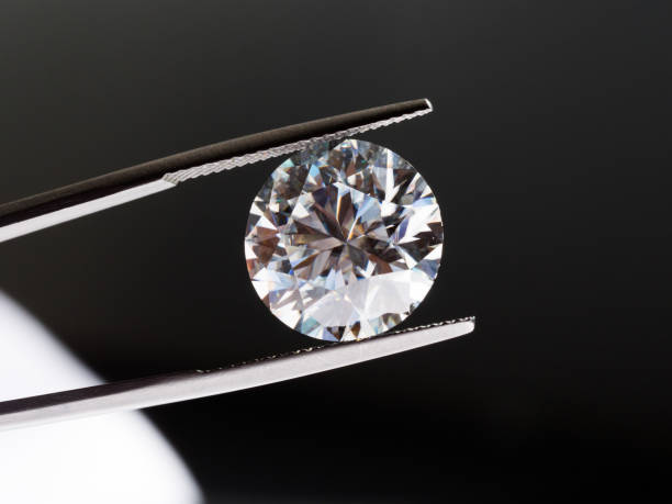 istock Diamond in Tweezers 1132051516