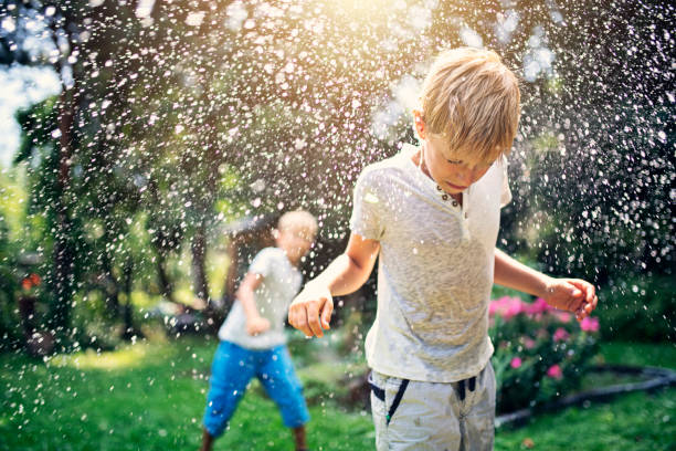 Children having water balloon fight Little boy is throwing water balloons at his brother.
Nikon D810 water balloon stock pictures, royalty-free photos & images