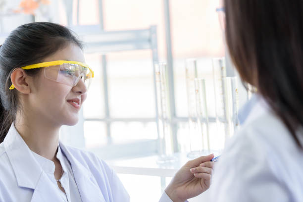 istock Asian young female working and research scientist together. 1132053691