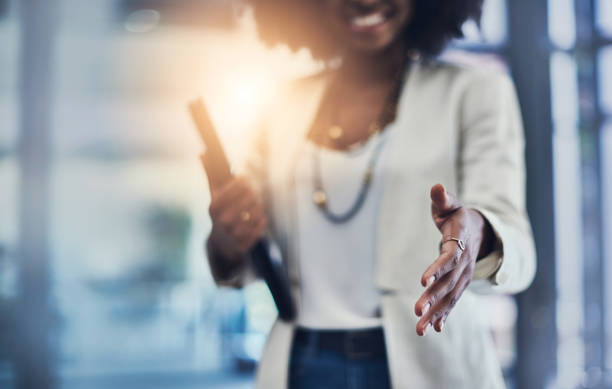 Welcome to the big leagues Shot of an unrecognizable businesswoman reaching out for a handshake greeting stock pictures, royalty-free photos & images