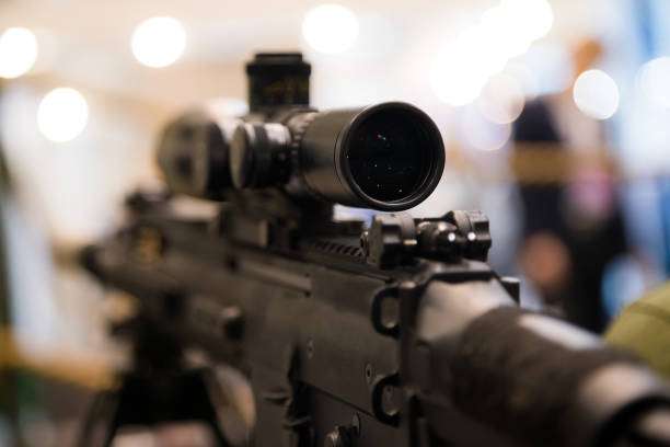 istock Young soldier aiming machine gun at target during military training in cadet corps. Cadet corps - initial military training school with the full Board to prepare youth for a military career. 1132055770