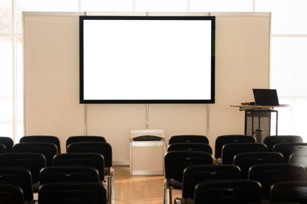 istock Empty screen in conference room, meeting room, boardroom, Classroom, Office, with white projector board. 1132055857