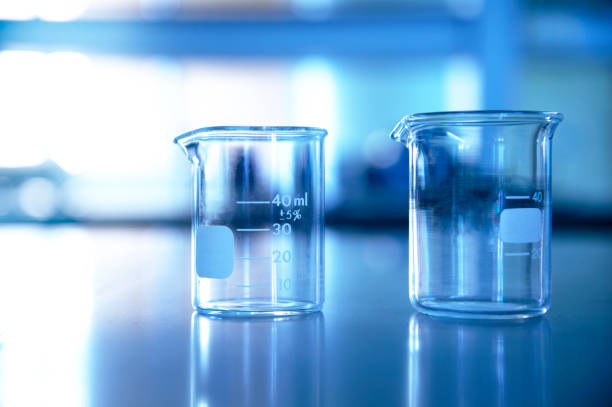 istock two glass beaker in chemical education science laboratory blue background 1132055908