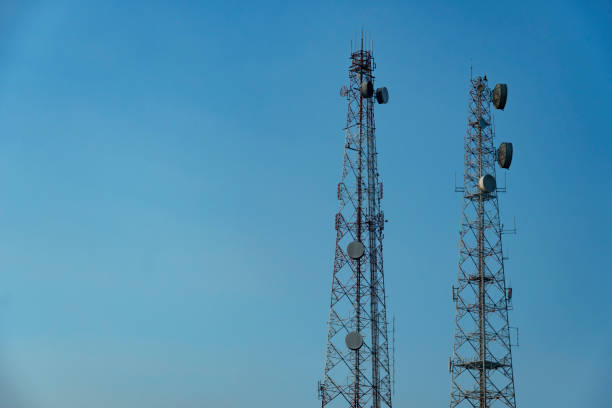 istock high two towers of broadcast telecommunication technology with blue sky background 1132057165