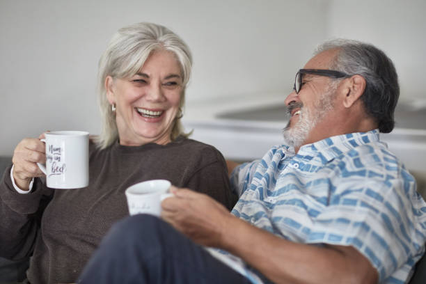 istock Happy couple enjoying coffee at home 1132057255