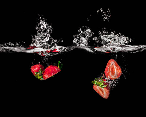 istock Fresh Strawberries with water splash over white background 1132057256