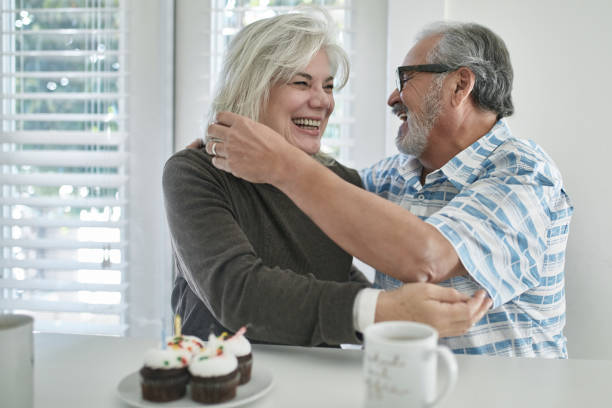 istock Man embracing woman during birthday celebration 1132057822