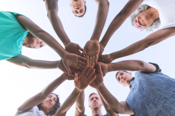 istock Low angle shot of multiethnic hands together for a 