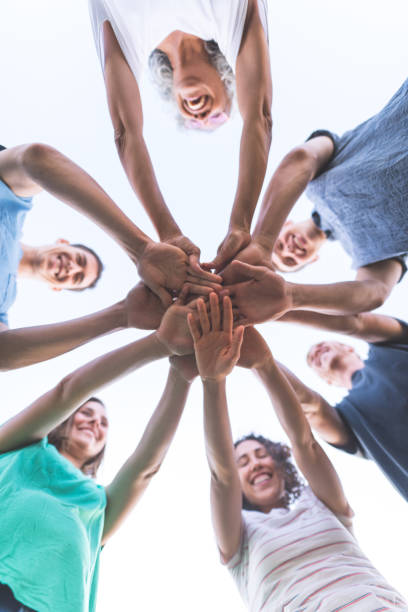 istock A multiethnic group puts their hands together for a 