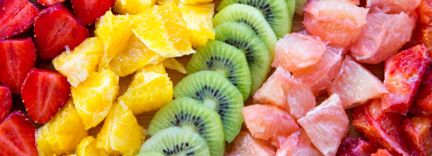 istock Chopped fresh colorful fruits on bamboo board, close-up. 1132058718