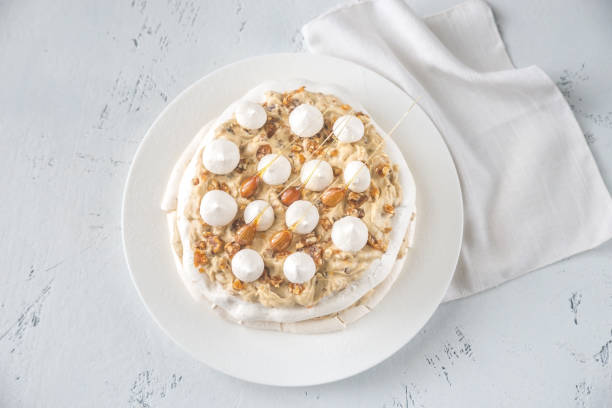 istock Pavlova cake with caramel and almonds 1132059084
