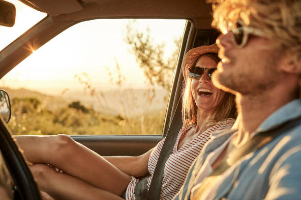 istock Cheerful woman looking at man driving van 1132059962