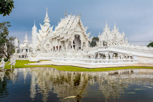 istock Wat Rong Khun, the White Temple with reflection 1132060658