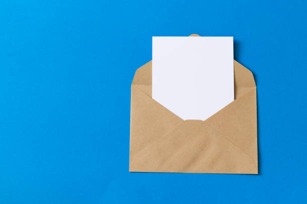istock Blank white card with kraft brown paper envelope template mock up 1132060709