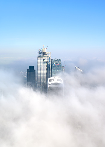 London's tall buildings poking through the morning fog