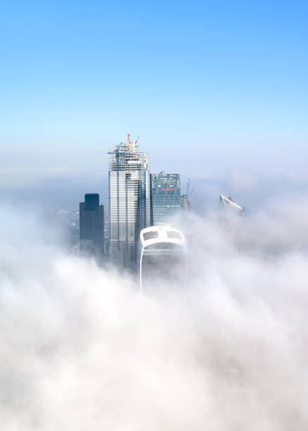 City of London skyscrapers surrounded by Clouds London's tall buildings poking through the morning fog 122 leadenhall street photos stock pictures, royalty-free photos & images
