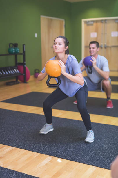 istock A co-ed group exercises together at the gym 1132060910