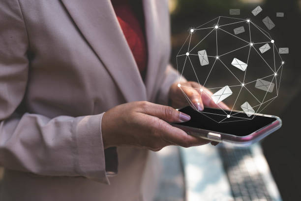 istock Business woman hands using mobile phone reading, sending and connecting with email icon. Business people freelance, new generation working outside office. Networking, technology connectivity concept 1132061056