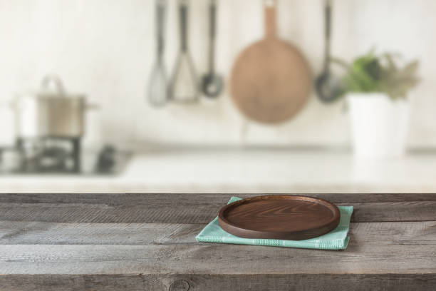 istock Modern kitchen with wooden tabletop, space for you and display products. 1132061251