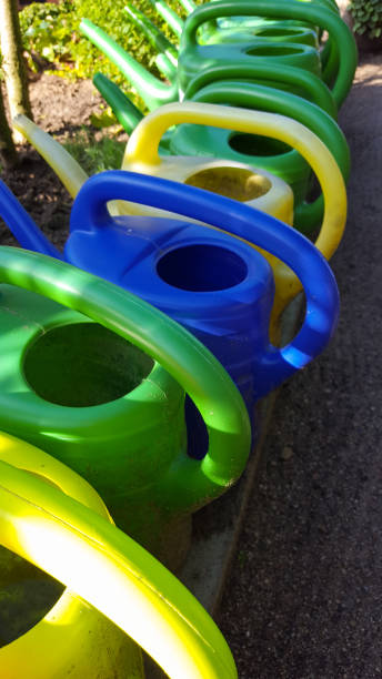 istock watering cans in a row waiting 1132061624