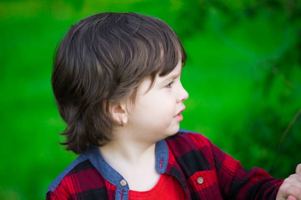 istock Face, serious, green background, close up 1132062224