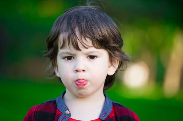 istock Face, serious, green background, close up 1132062842