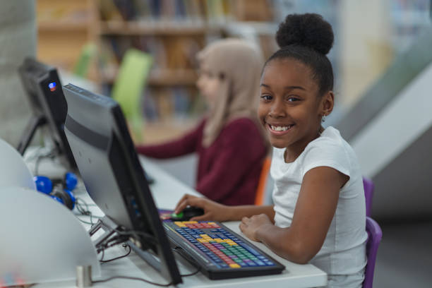 istock Smiling computer girl portrait 1132066680