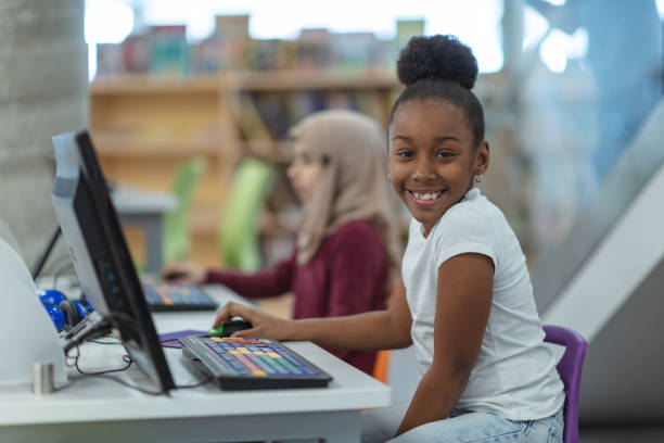 istock Smiling computer girl portrait 1132066684