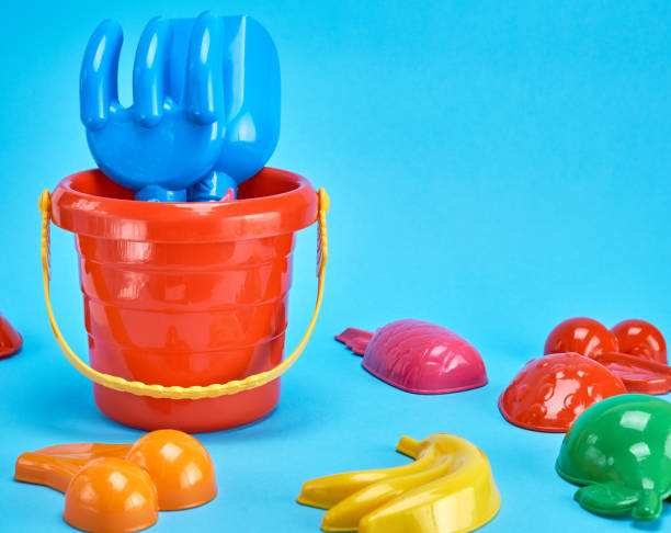 istock baby plastic red bucket and other items 1132068679