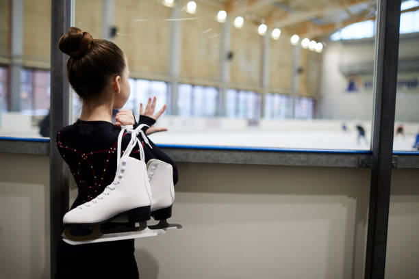 istock Girl Watching Figure Skaters 1132071031