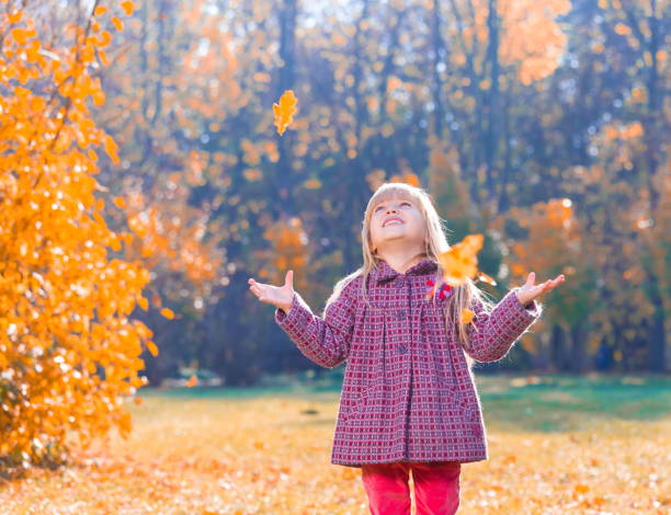 Girl, garden, autumn, falling leaves
