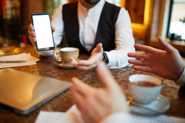 istock Businessman Showing Mobile App 1132071562
