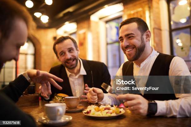 Business People In Restaurant Stock Photo - Download Image Now - Eating, Dinner, Suit