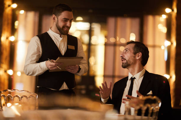 istock Businessman Ordering Food in Restaurant 1132071625