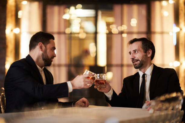 istock Celebrating Deal in Restaurant 1132071634