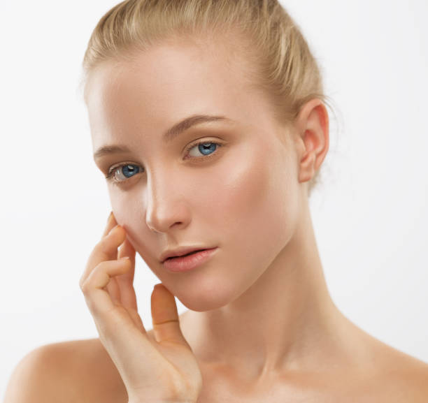 istock Face, serious, hands, blue lenses, close up, white background 1132071818